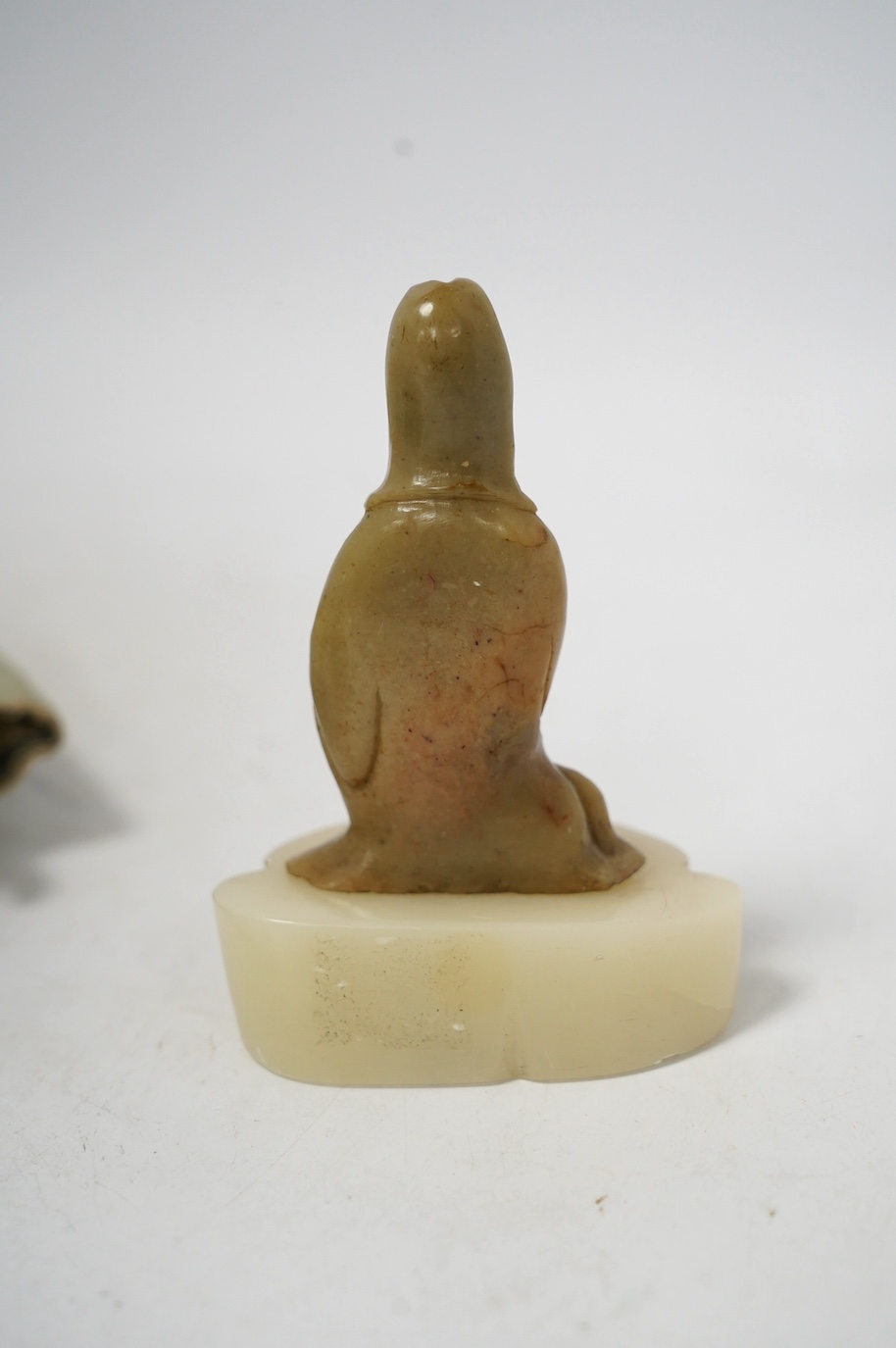 Two Chinese Door of Hope missionary wood and fabric dolls, early 20th century, 30cm, and a Chinese soapstone figure of Guanyin, 18th/19th century, 10.5cm. Condition - fair, feet missing to one and other minor wear etc.